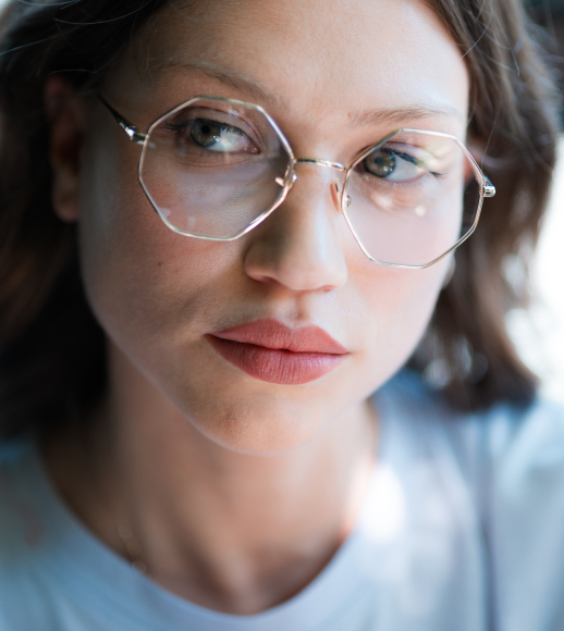 Prada PR 65ZS ZVN09T Oval Pale Gold Sunglasses | SmartBuyGlasses